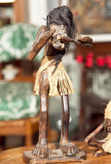 Two Tribal Wood Figures During Ceremony